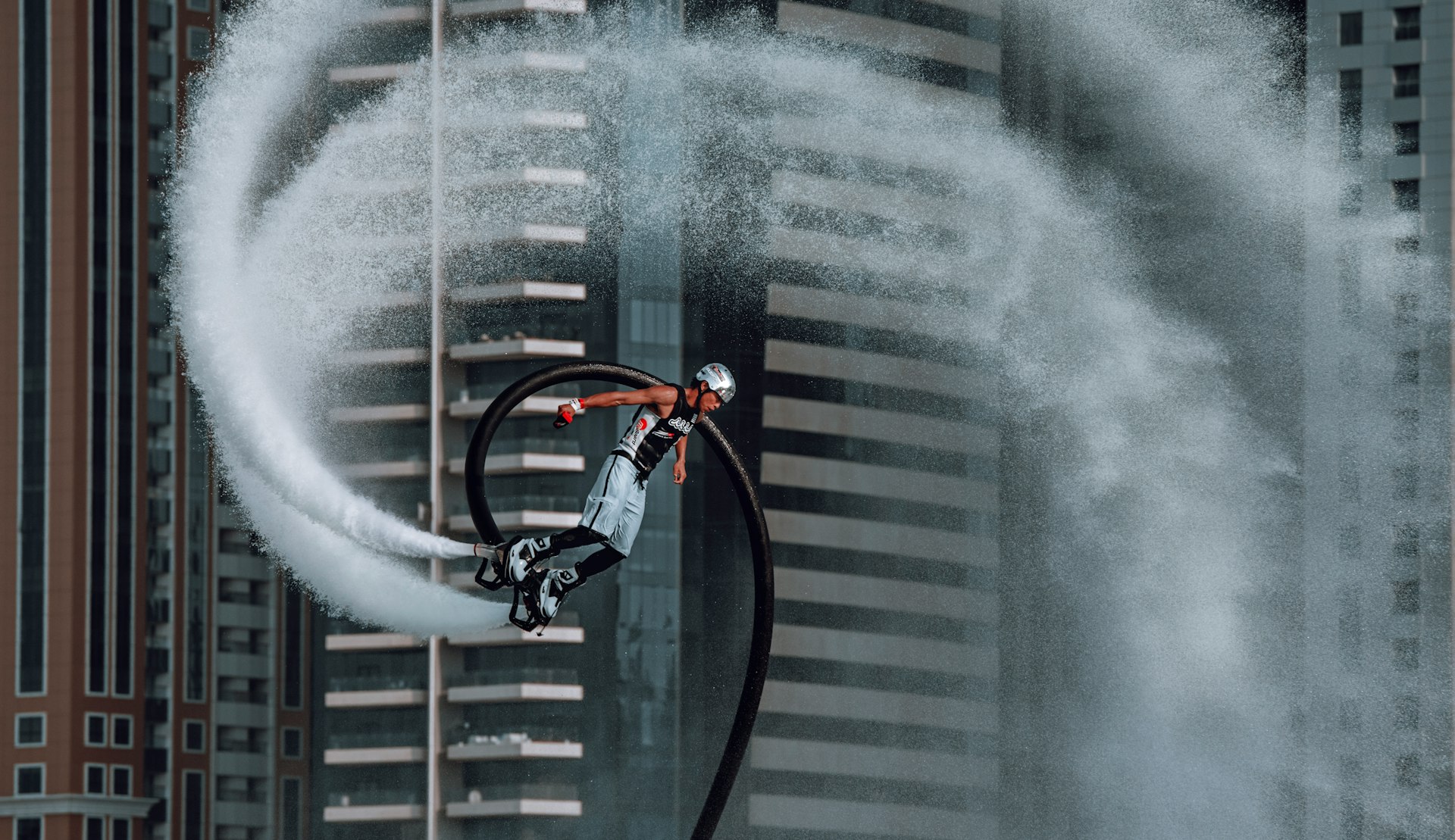 man in black jacket riding bicycle on road